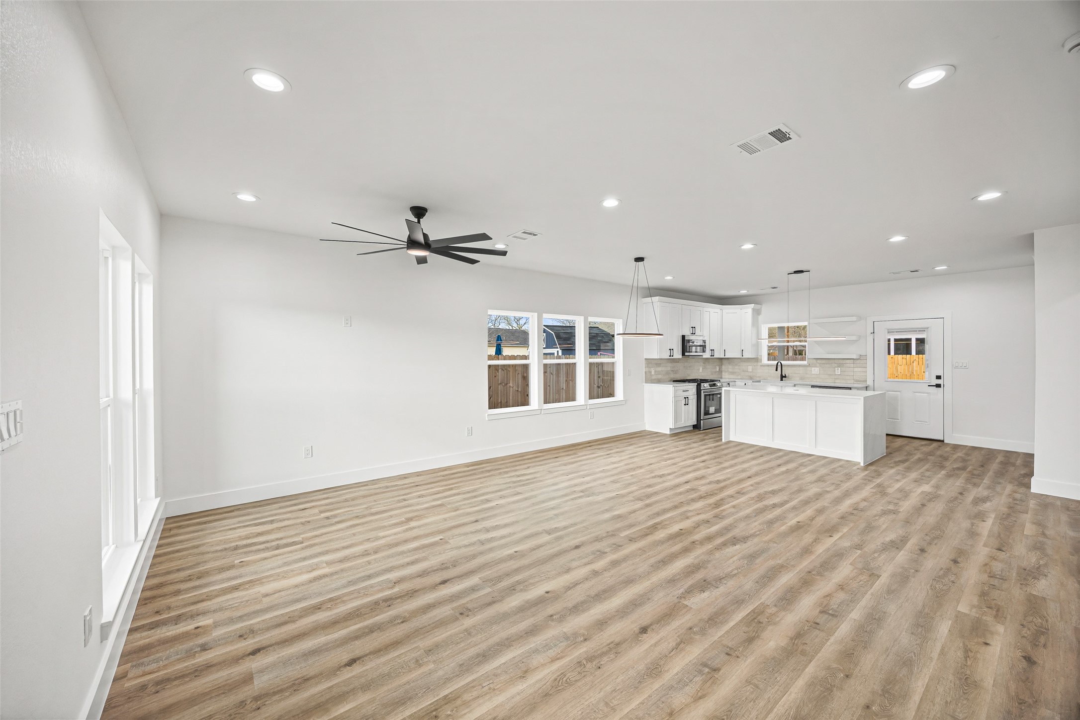 1807 Waco Street Dayton, TX 77535 - Photo 4 of 26 Seamless flow between living, dining, and kitchen areas—ideal for entertaining and everyday living.