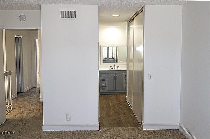 3224 Sunset Lane Oxnard, CA 93035 - Photo 11 of 20 a view of a hallway with a dining room