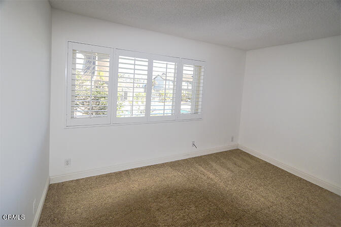 3224 Sunset Lane Oxnard, CA 93035 - Photo 12 of 20 a view of an empty room with a window