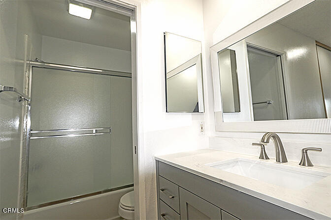 3224 Sunset Lane Oxnard, CA 93035 - Photo 14 of 20 a bathroom with a sink and mirror
