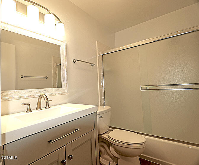 3224 Sunset Lane Oxnard, CA 93035 - Photo 17 of 20 a bathroom with a sink a toilet a mirror and shower