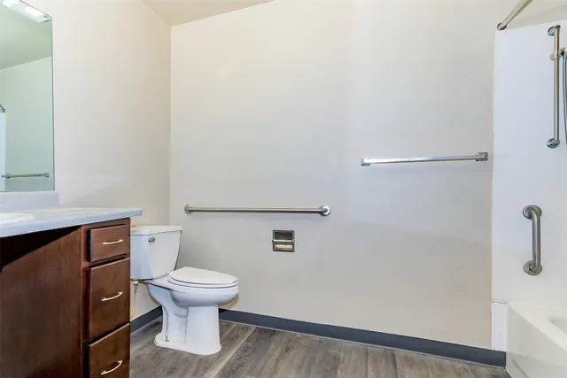 a bathroom with a toilet and a sink