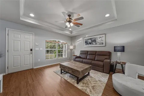 a living room with furniture and a window