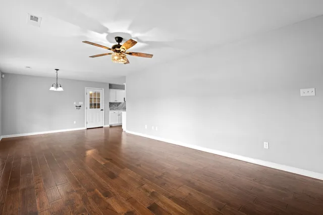 a kitchen with stainless steel appliances a sink stove and cabinets