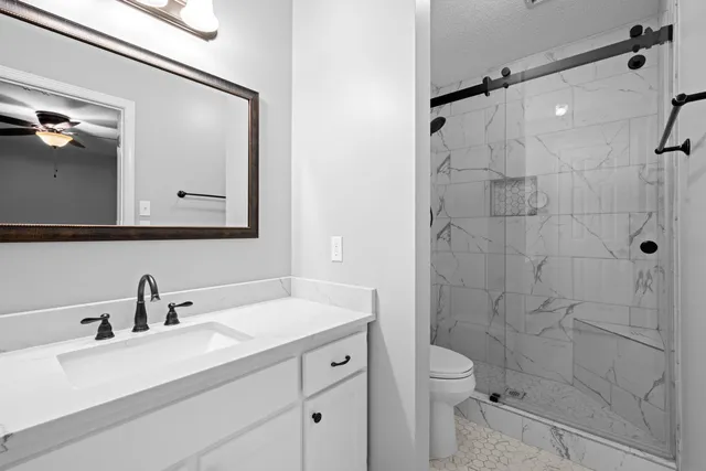 a front view of house with yard and trees