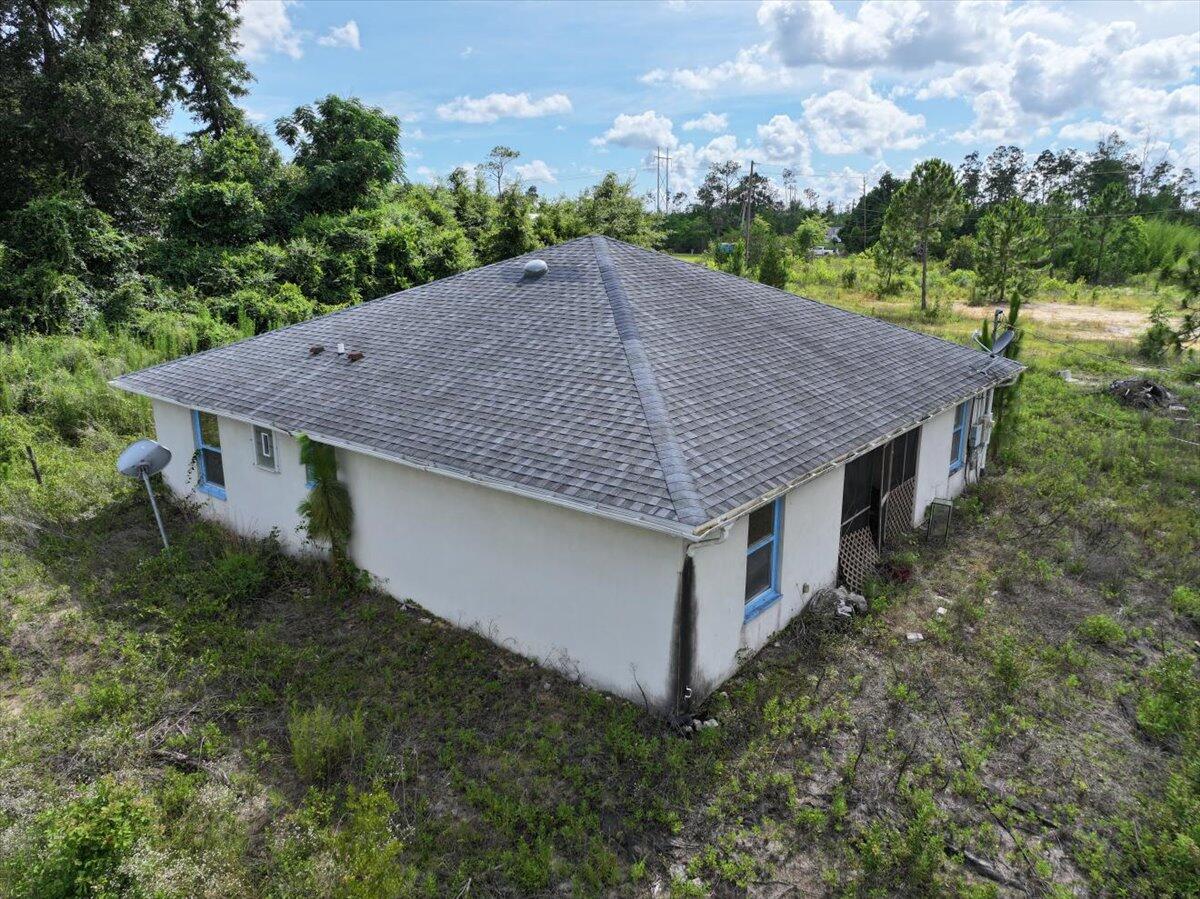 5704 Arnold Road Panama City, FL 32404 - Photo 14 of 25 an aerial view of a house with yard and outdoor seating