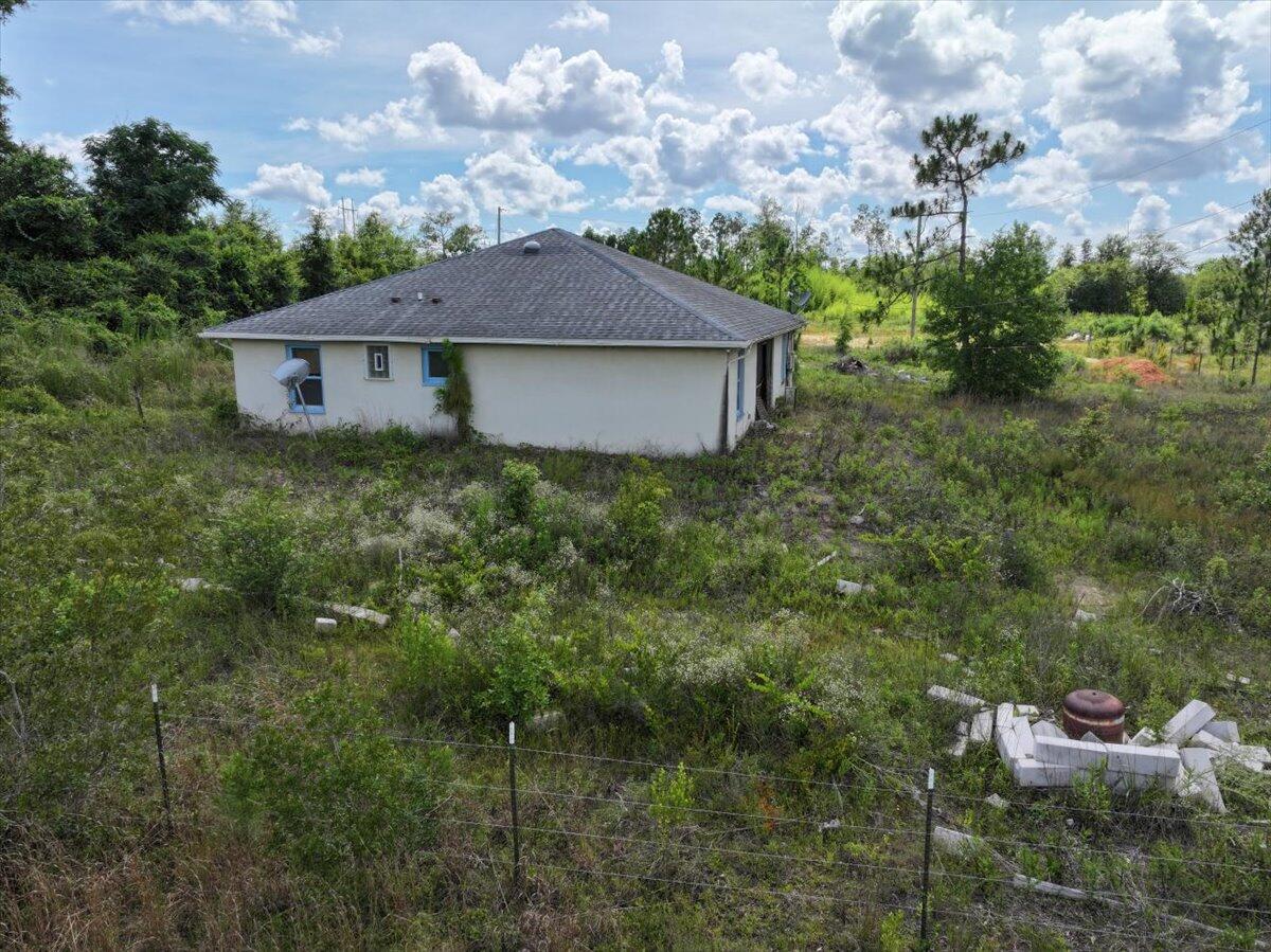 5704 Arnold Road Panama City, FL 32404 - Photo 16 of 25 a view of a house with a yard