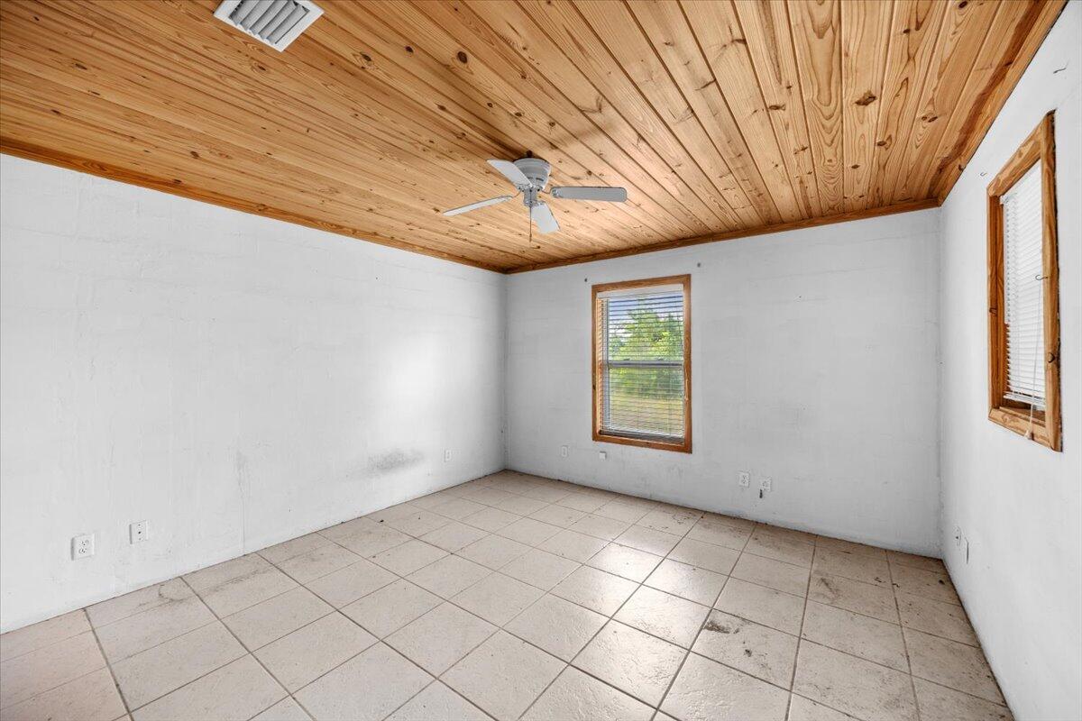 5704 Arnold Road Panama City, FL 32404 - Photo 20 of 25 a view of room with window and chandelier