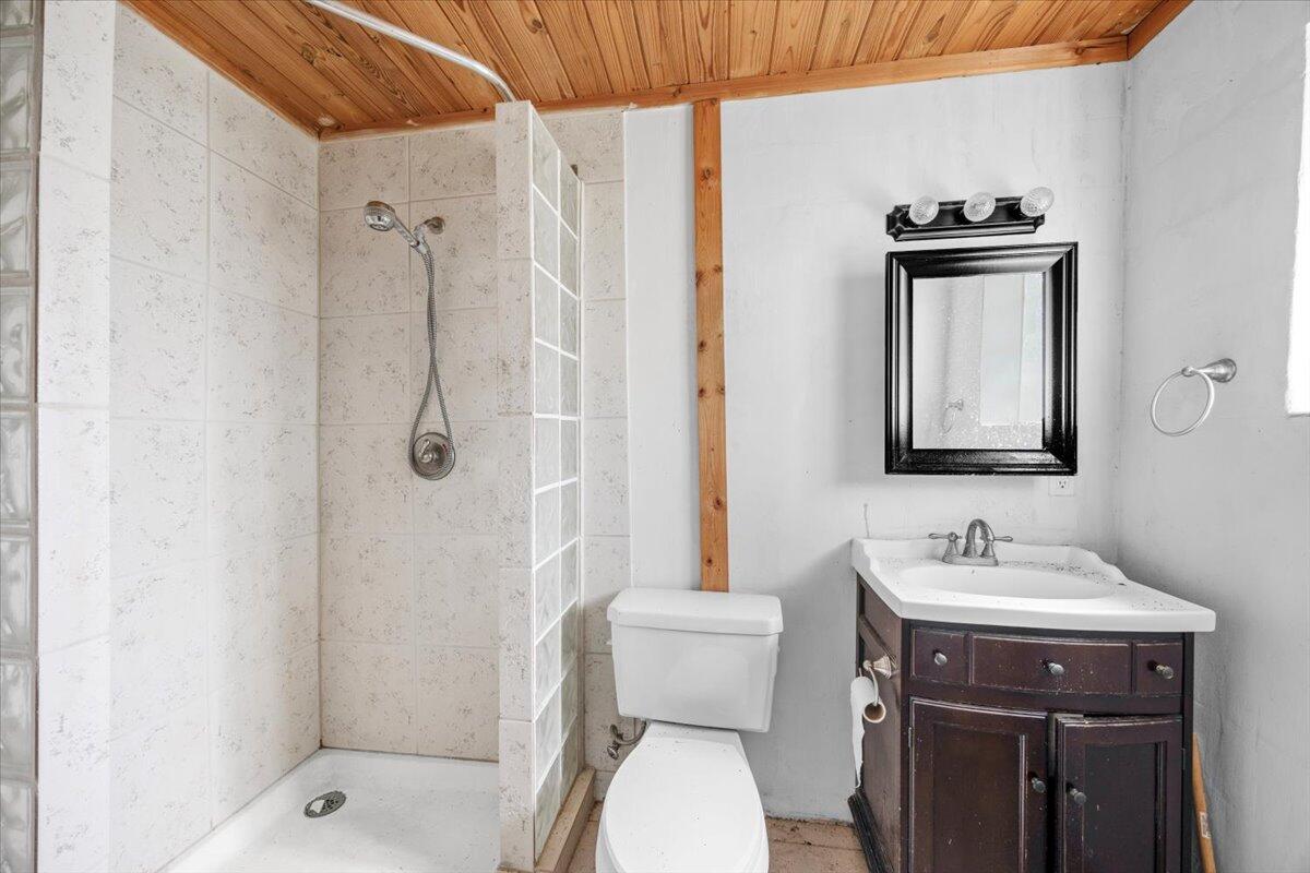 5704 Arnold Road Panama City, FL 32404 - Photo 25 of 25 a bathroom with a sink toilet and shower