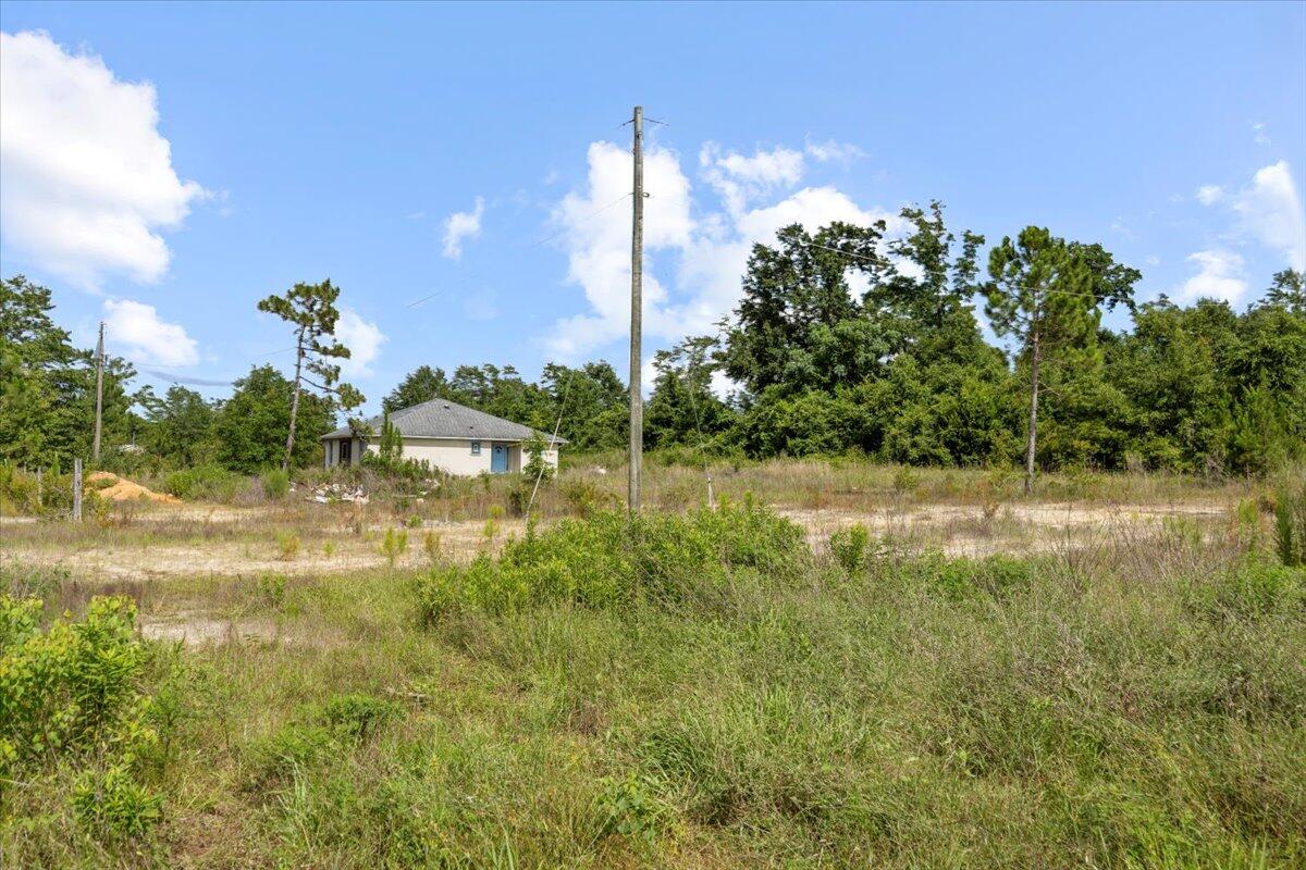 5704 Arnold Road Panama City, FL 32404 - Photo 6 of 25 a view of a lake with a yard
