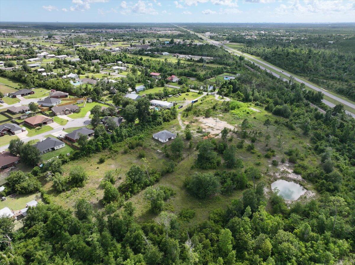 5704 Arnold Road Panama City, FL 32404 - Photo 8 of 25 an aerial view of a city with lots of residential buildings