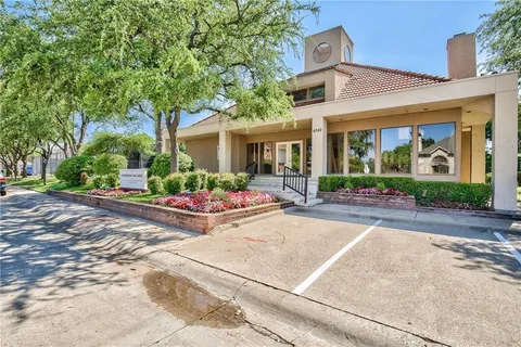 front view of a house with a garden