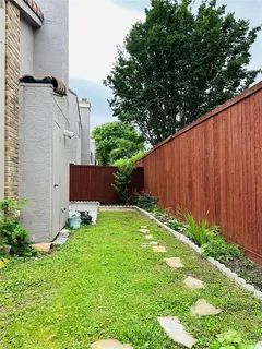 a backyard of a house with lots of green space
