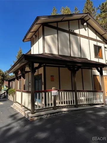 a front view of a house with garage