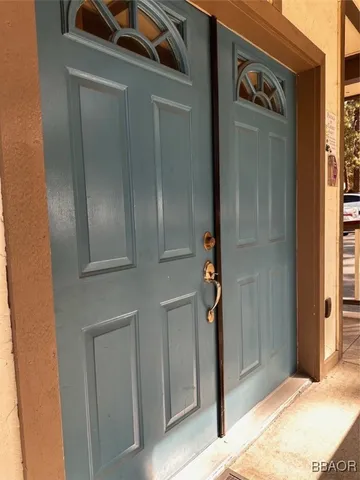 a view of a entryway with a flat screen tv