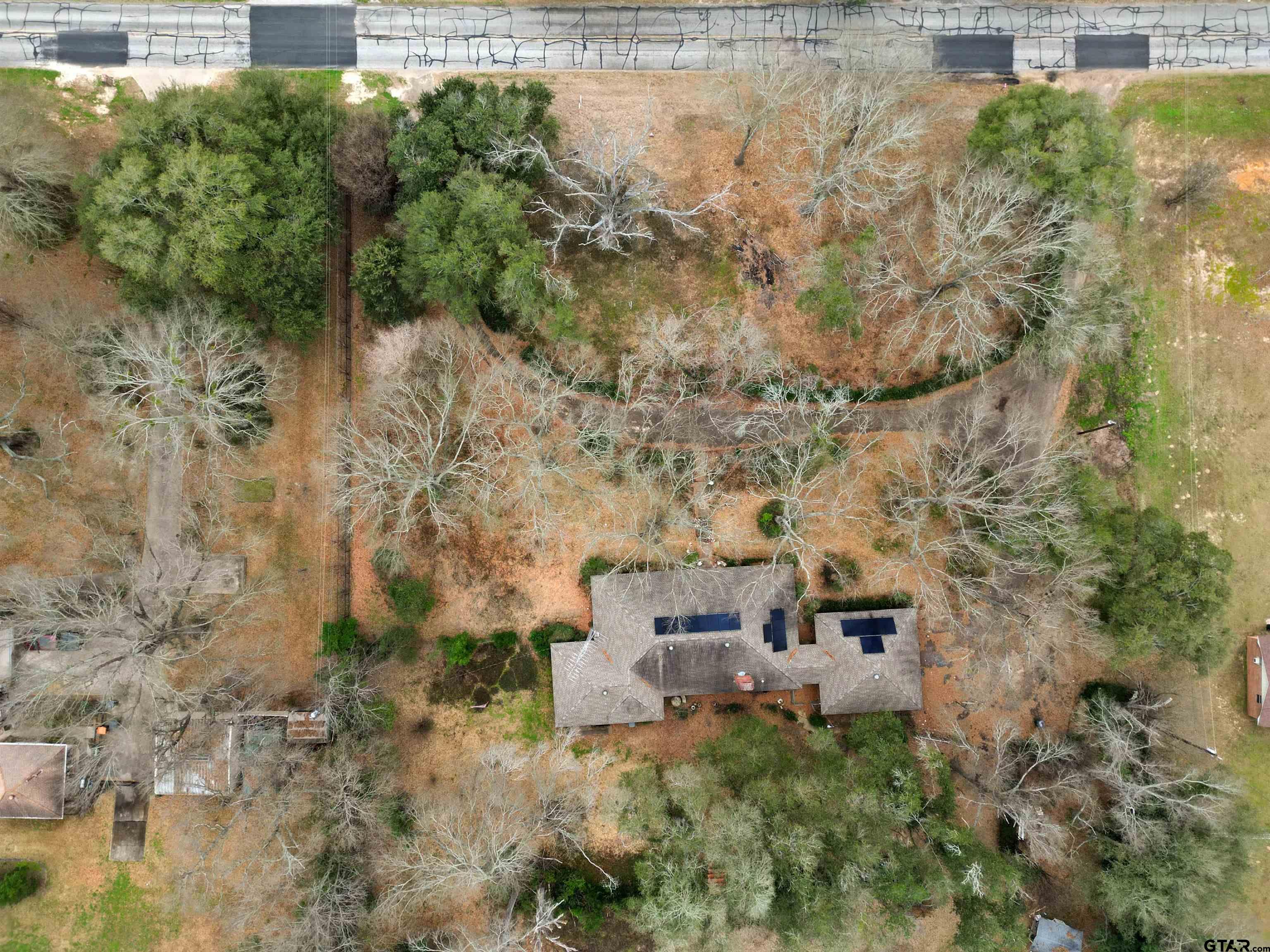 1004 Jeff Davis Drive Tyler, TX 75703 - Photo 7 of 12 a aerial view of residential house with outdoor space