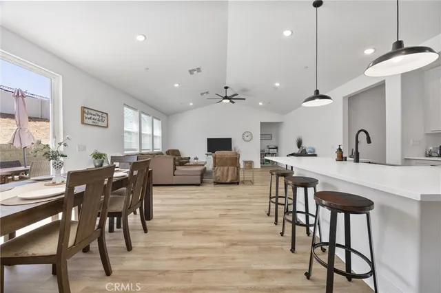 a living room with furniture a table and chairs