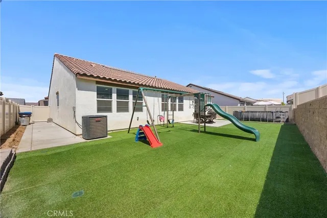 an aerial view of residential houses and outdoor space