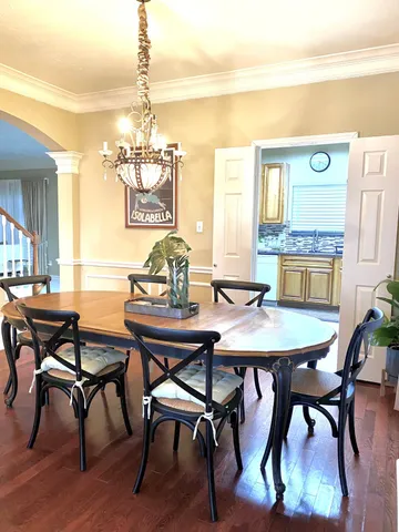 a dining room with furniture and window