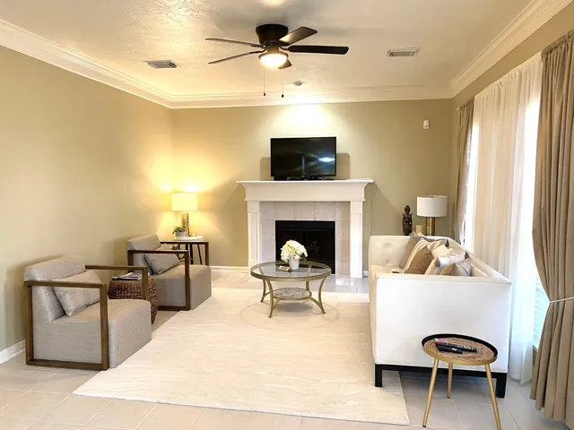 a living room with furniture and a fireplace