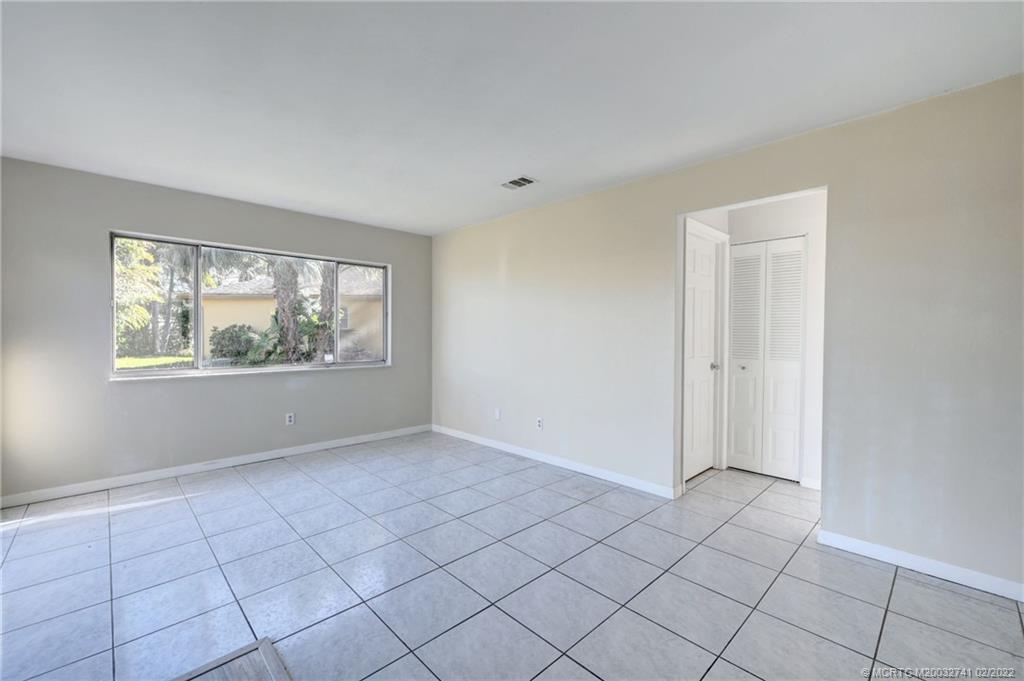 297 Southwest Homeland Road Port St. Lucie, FL 34953 - Photo 15 of 32 a view of an empty room and window