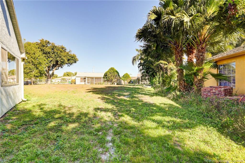 297 Southwest Homeland Road Port St. Lucie, FL 34953 - Photo 31 of 32 a view of the garden