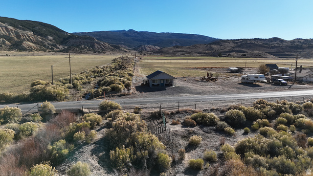 890 East Hatchery Road Bicknell, UT 84715 - Photo 23 of 48 View of mountain backdrop with rural landscape
