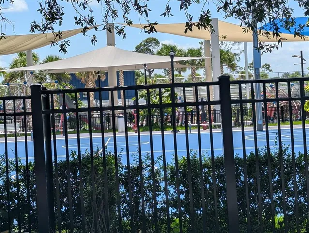 a view of a street with flower plants