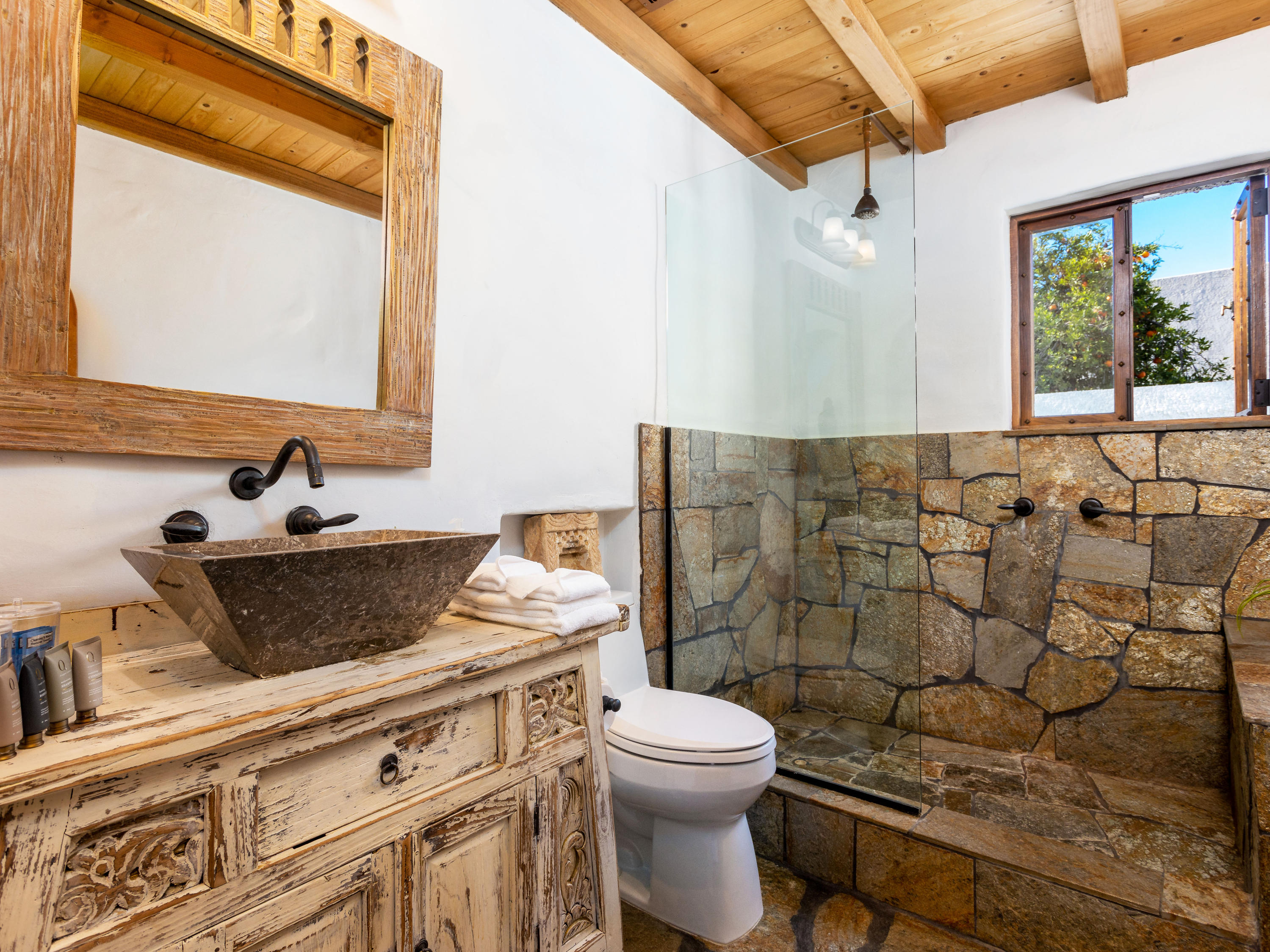 71607 Sahara Road Rancho Mirage, CA 92270 - Photo 22 of 40 a bathroom with a sink toilet vanity and window
