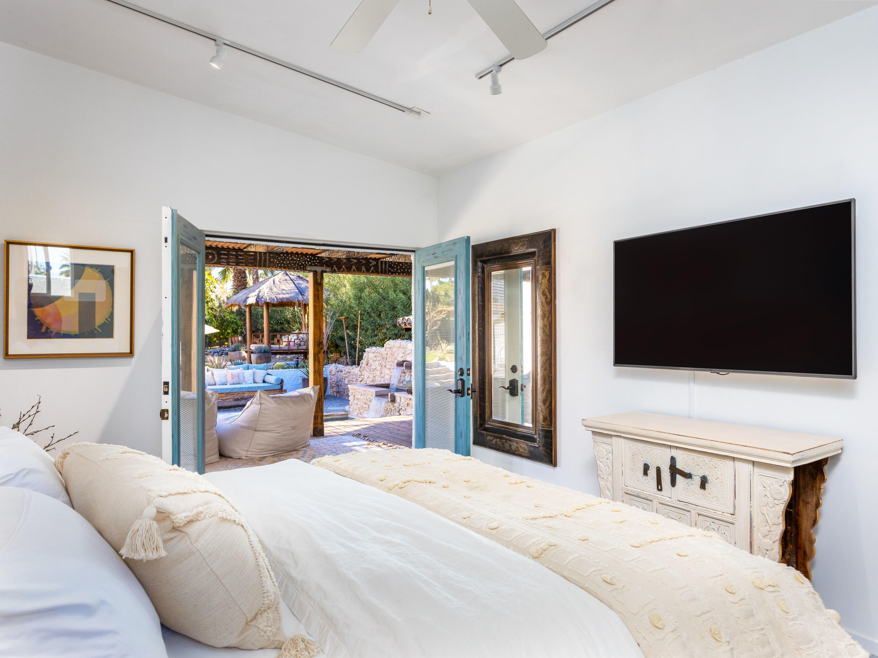 71607 Sahara Road Rancho Mirage, CA 92270 - Photo 29 of 40 a bedroom with a bed and a flat screen tv