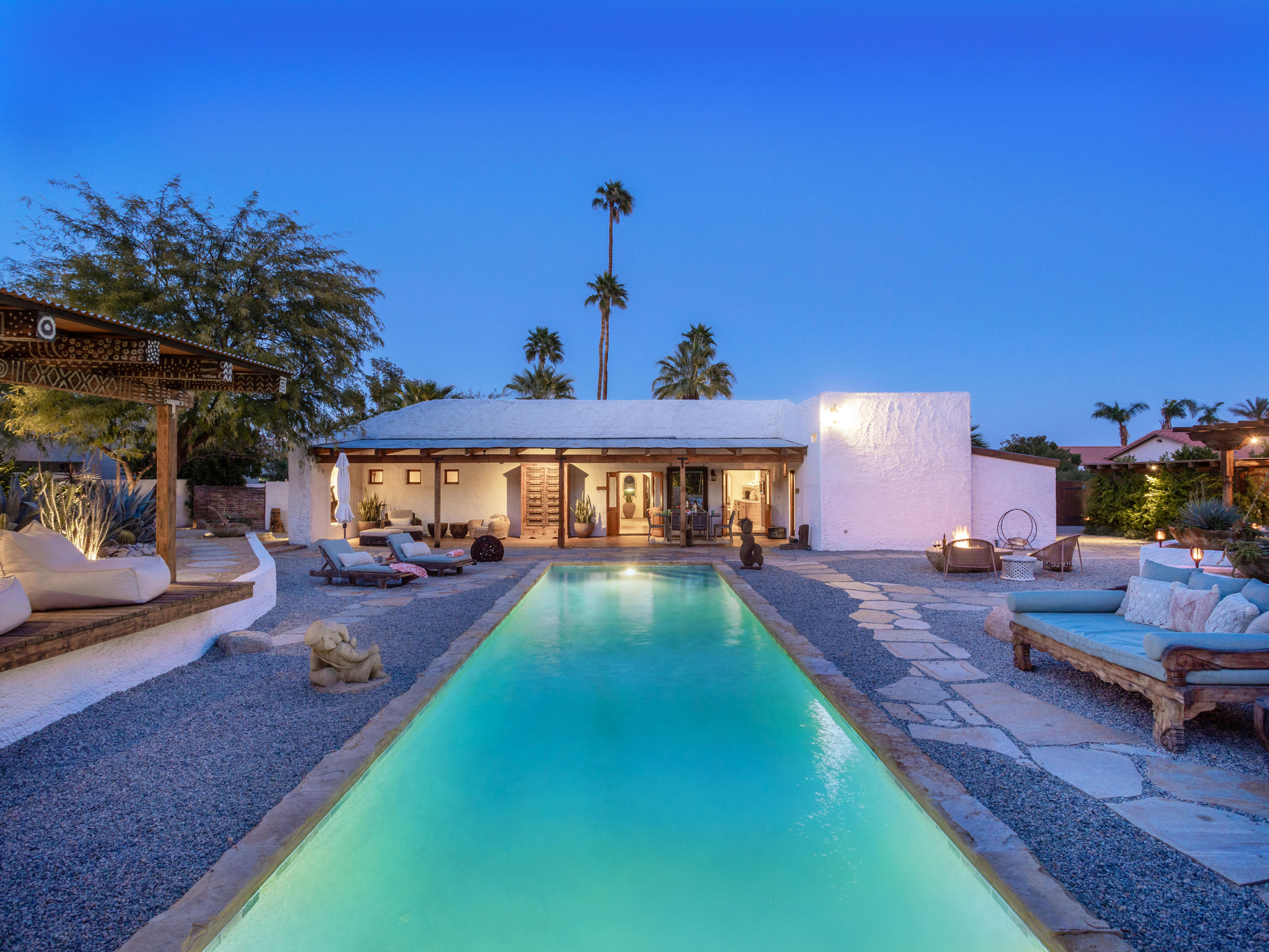 71607 Sahara Road Rancho Mirage, CA 92270 - Photo 39 of 40 a view of a house with backyard patio and fire pit