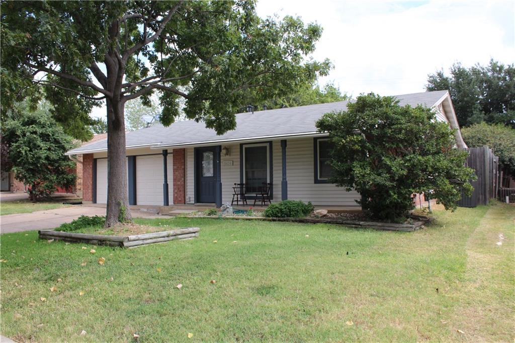 3424 Cardinal Lane Irving, TX 75062 - Photo 1 of 1 a front view of a house with a garden