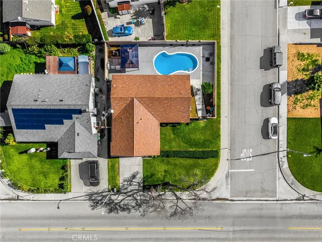 an aerial view of houses with yard