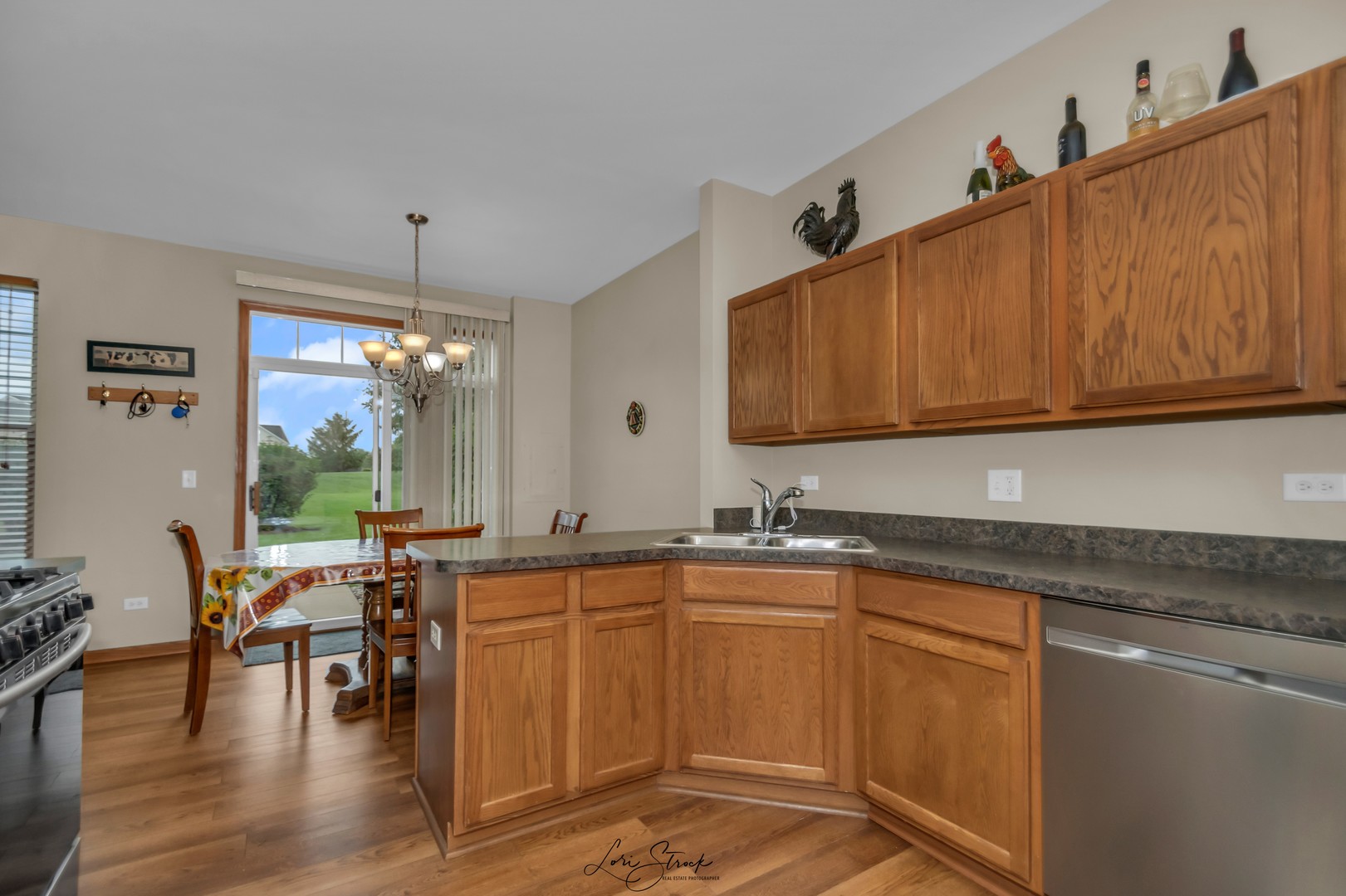 25009 Clare Circle Manhattan, IL 60442 - Photo 12 of 20 a kitchen with lots of counter top space and dining table