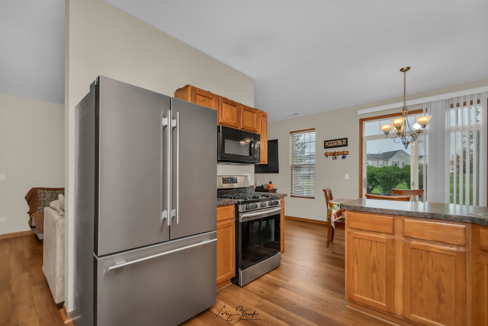 25009 Clare Circle Manhattan, IL 60442 - Photo 13 of 20 a kitchen with stainless steel appliances a refrigerator stove and sink