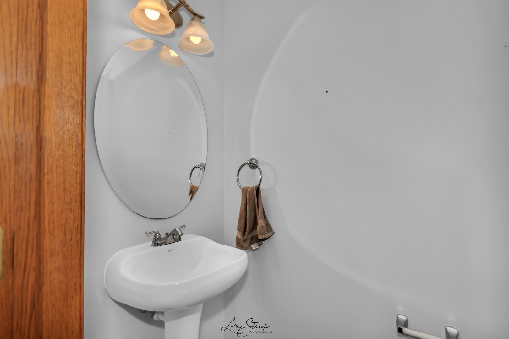 25009 Clare Circle Manhattan, IL 60442 - Photo 14 of 20 a bathroom with a sink a mirror and vanity