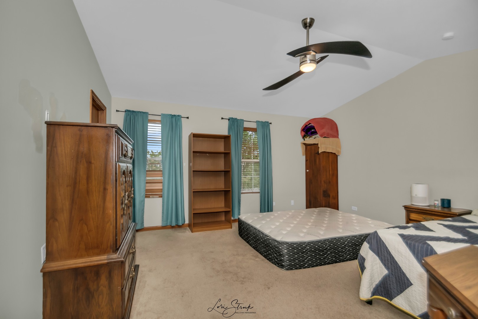 25009 Clare Circle Manhattan, IL 60442 - Photo 15 of 20 a bedroom with a bed and a chandelier