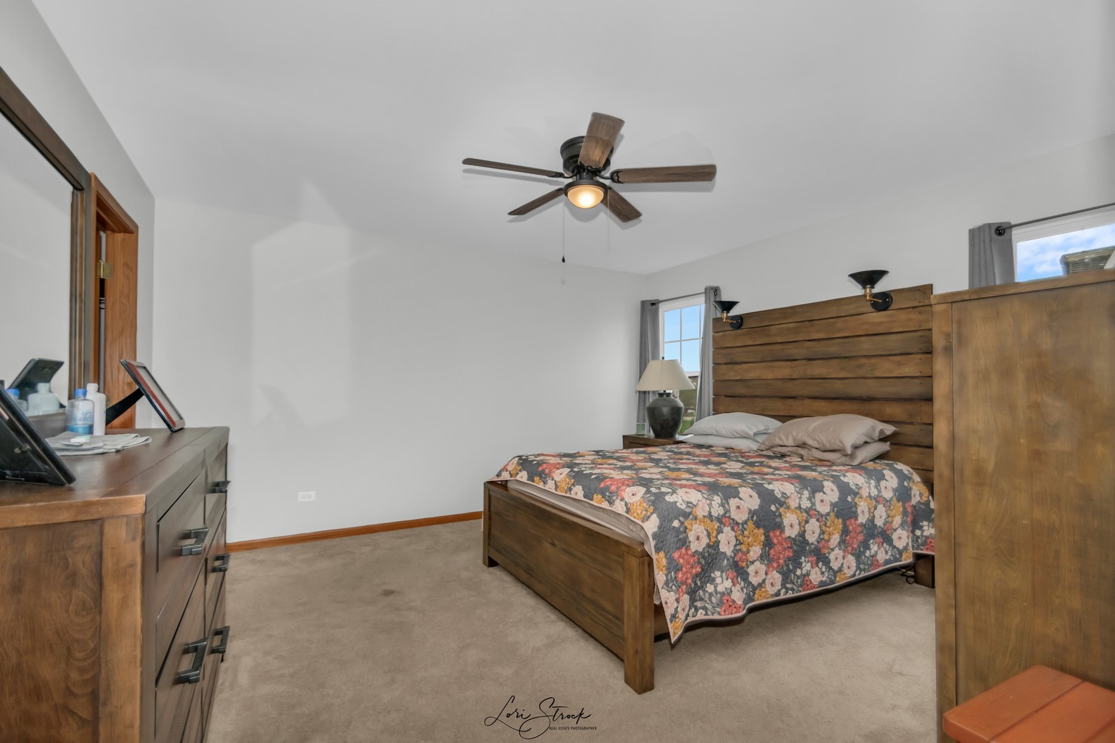 25009 Clare Circle Manhattan, IL 60442 - Photo 19 of 20 a bedroom with a bed a dresser and a window