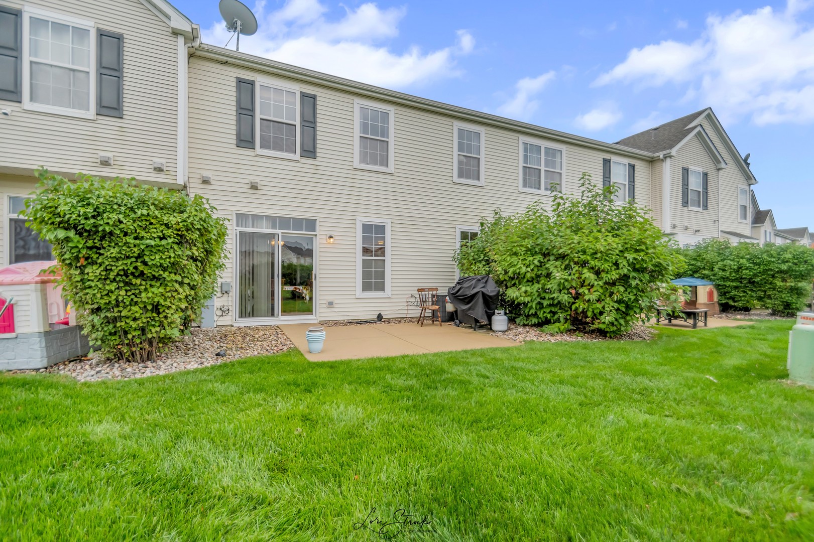 25009 Clare Circle Manhattan, IL 60442 - Photo 7 of 20 a front view of a house with a yard and trees