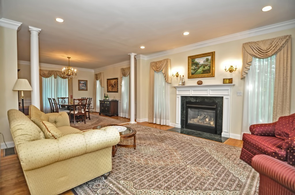 316 Hartman Road Newton, MA 02459 - Photo 14 of 30 a living room with furniture and a fireplace