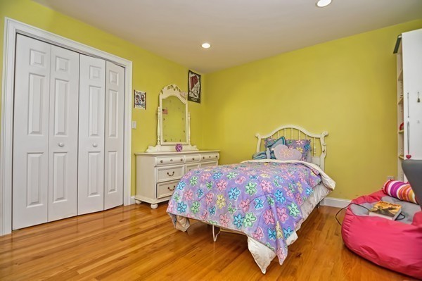 316 Hartman Road Newton, MA 02459 - Photo 18 of 30 a bedroom with a bed and wooden floor