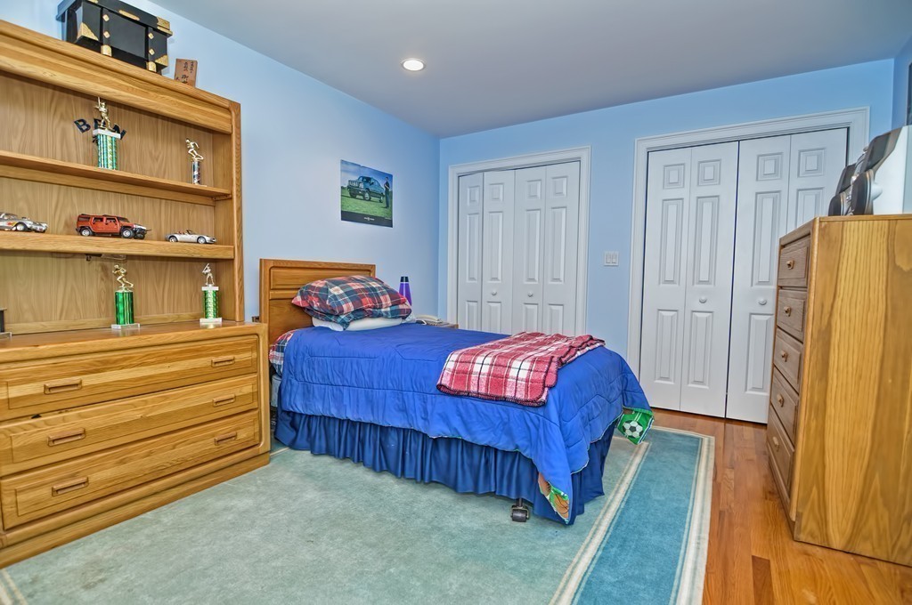316 Hartman Road Newton, MA 02459 - Photo 24 of 30 a bedroom with a bed and a large mirror on the dresser