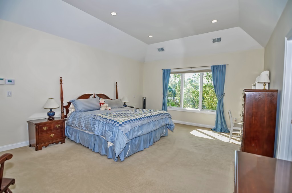 316 Hartman Road Newton, MA 02459 - Photo 25 of 30 a bedroom with a bed and wooden floor