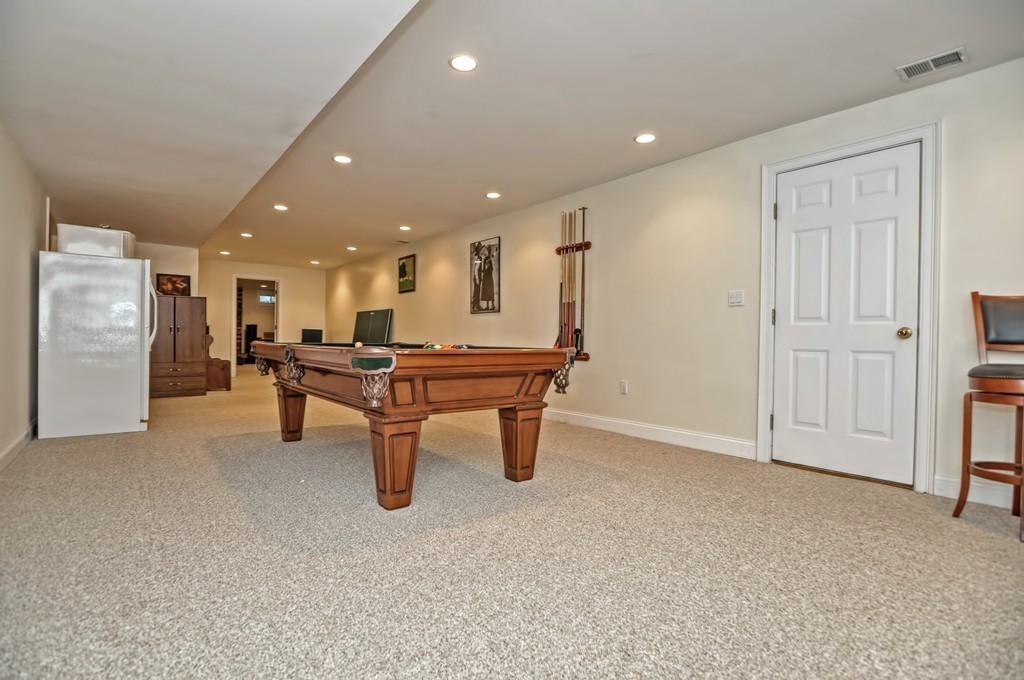 316 Hartman Road Newton, MA 02459 - Photo 29 of 30 a room with wooden furniture and white walls