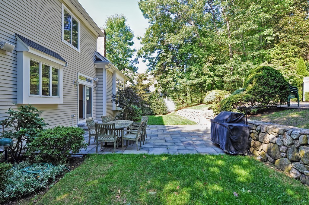 316 Hartman Road Newton, MA 02459 - Photo 6 of 30 a view of a table and chairs in backyard of the house