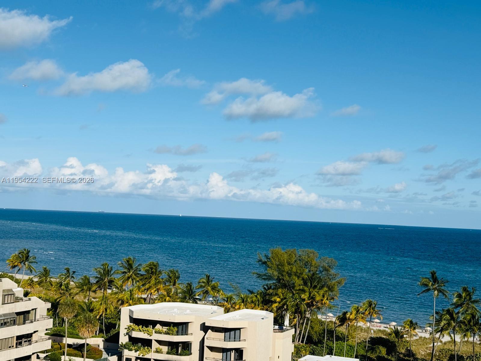 201 Crandon Boulevard, Unit 928 Key Biscayne, FL 33149 - Photo 2 of 4 a view of a city and ocean view