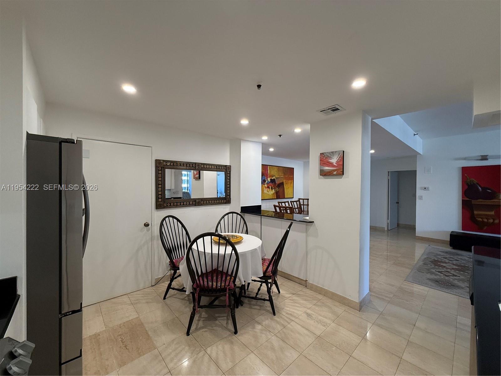 201 Crandon Boulevard, Unit 928 Key Biscayne, FL 33149 - Photo 23 of 38 a view of a livingroom with furniture and a refrigerator