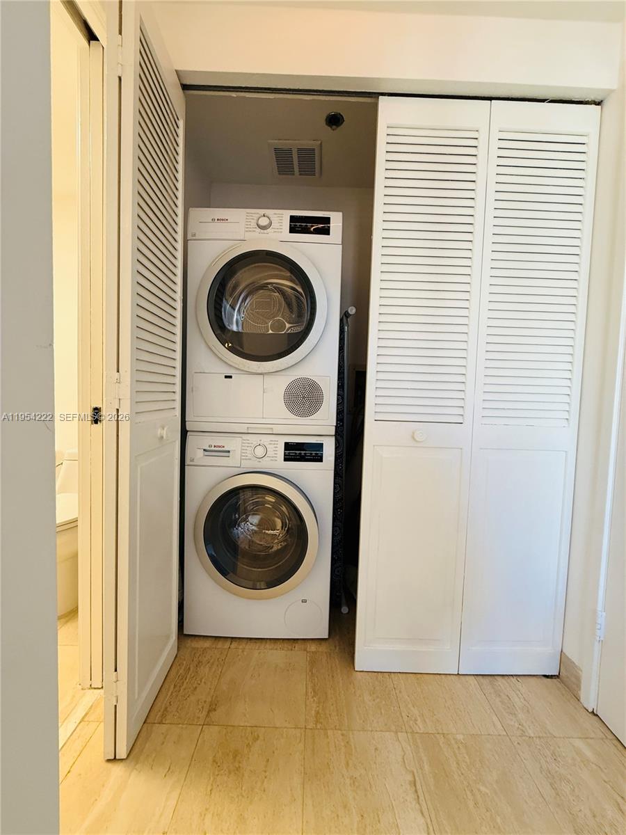 201 Crandon Boulevard, Unit 928 Key Biscayne, FL 33149 - Photo 25 of 38 a utility room with dryer and washer