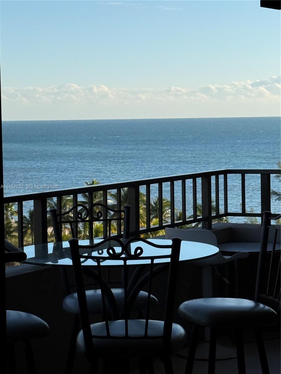 201 Crandon Boulevard, Unit 928 Key Biscayne, FL 33149 - Photo 3 of 38 a view of a dining room with furniture and window
