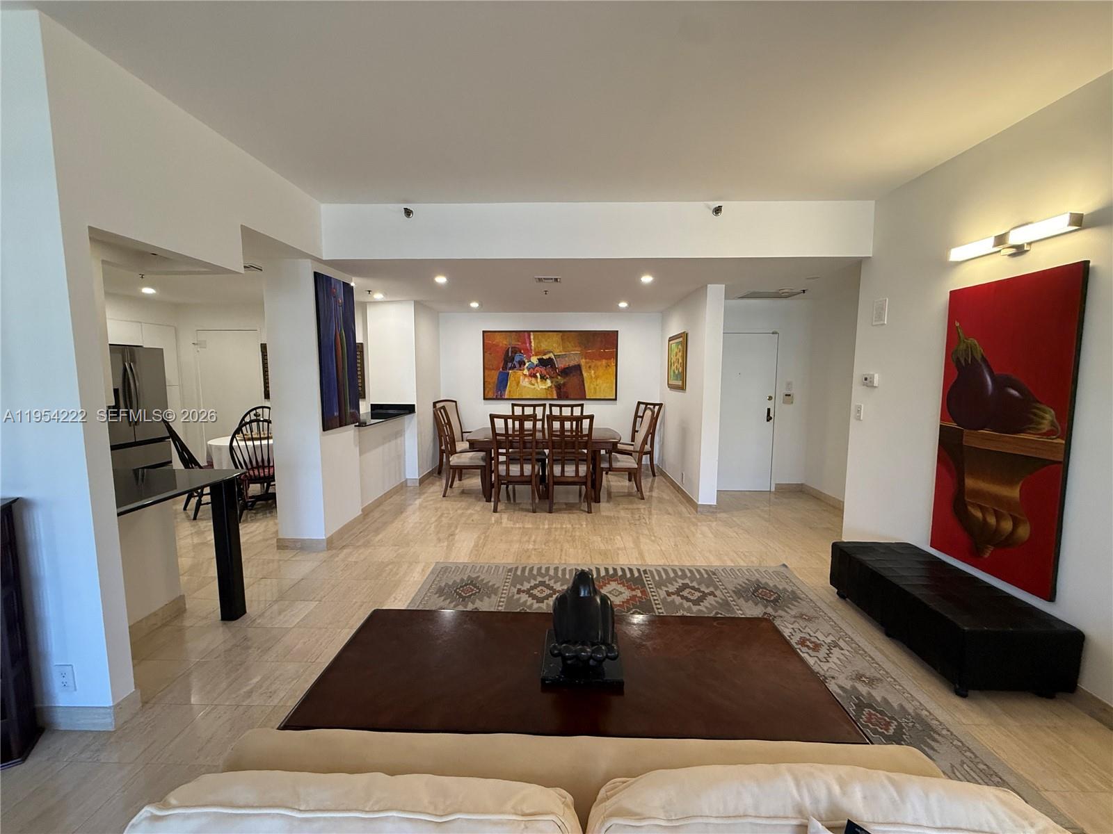 201 Crandon Boulevard, Unit 928 Key Biscayne, FL 33149 - Photo 7 of 38 a living room with furniture and a flat screen tv